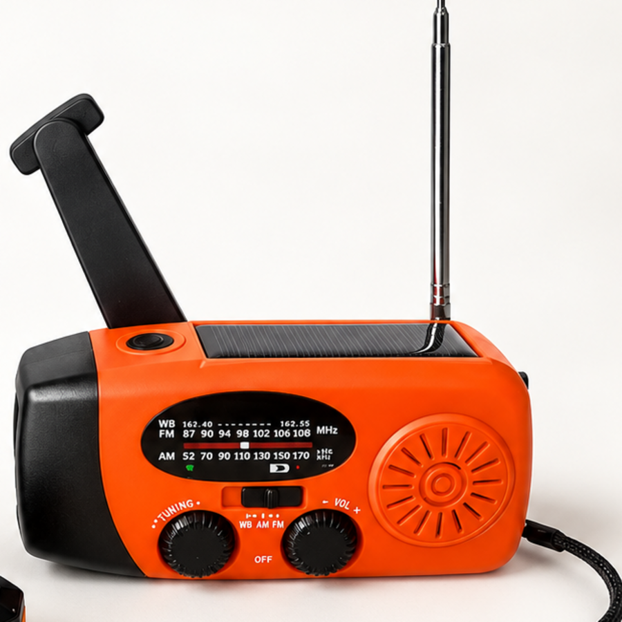 Emergency hand-crank and solar radio on a white background