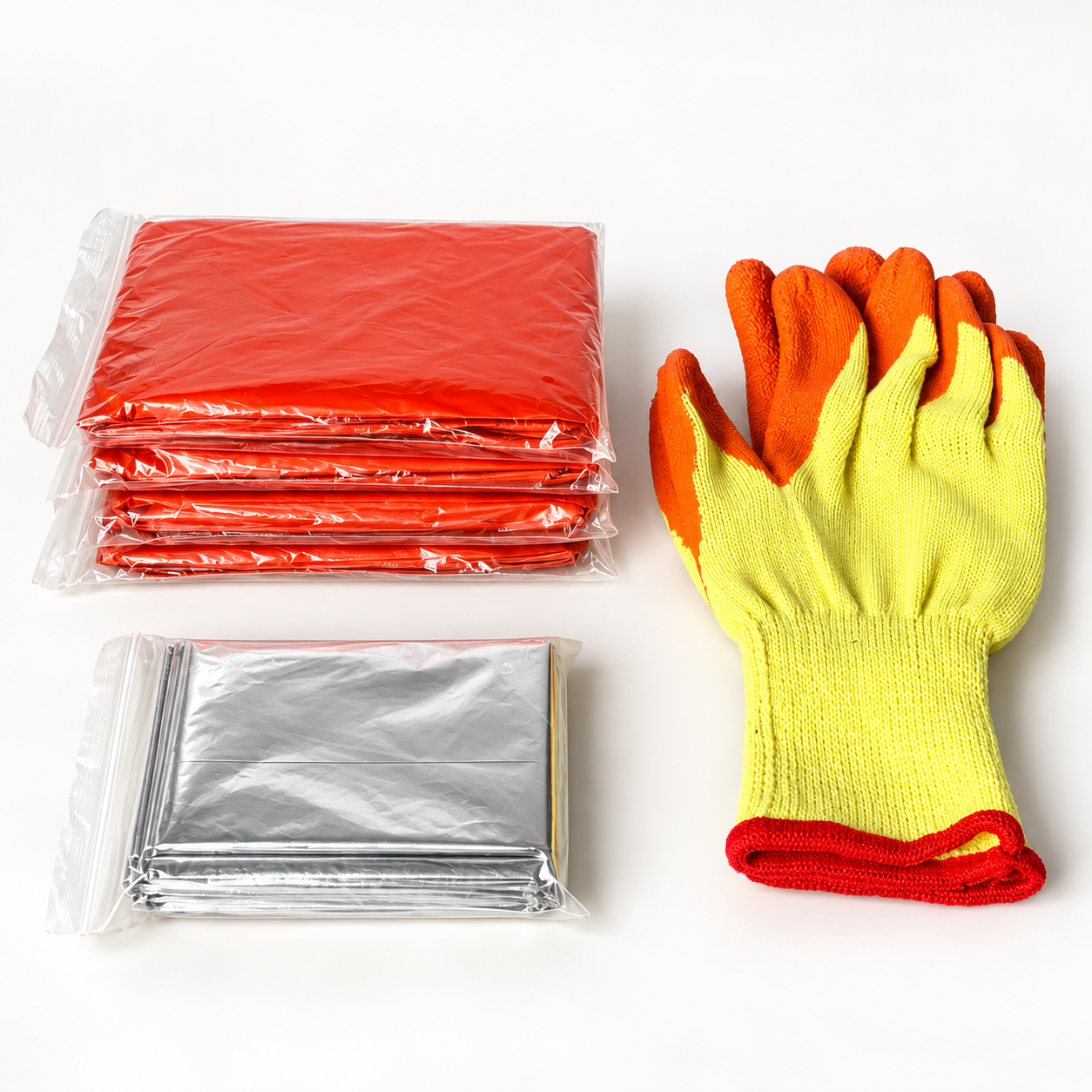 Four emergency rain ponchos, one foil emergency blanket and protective gloves